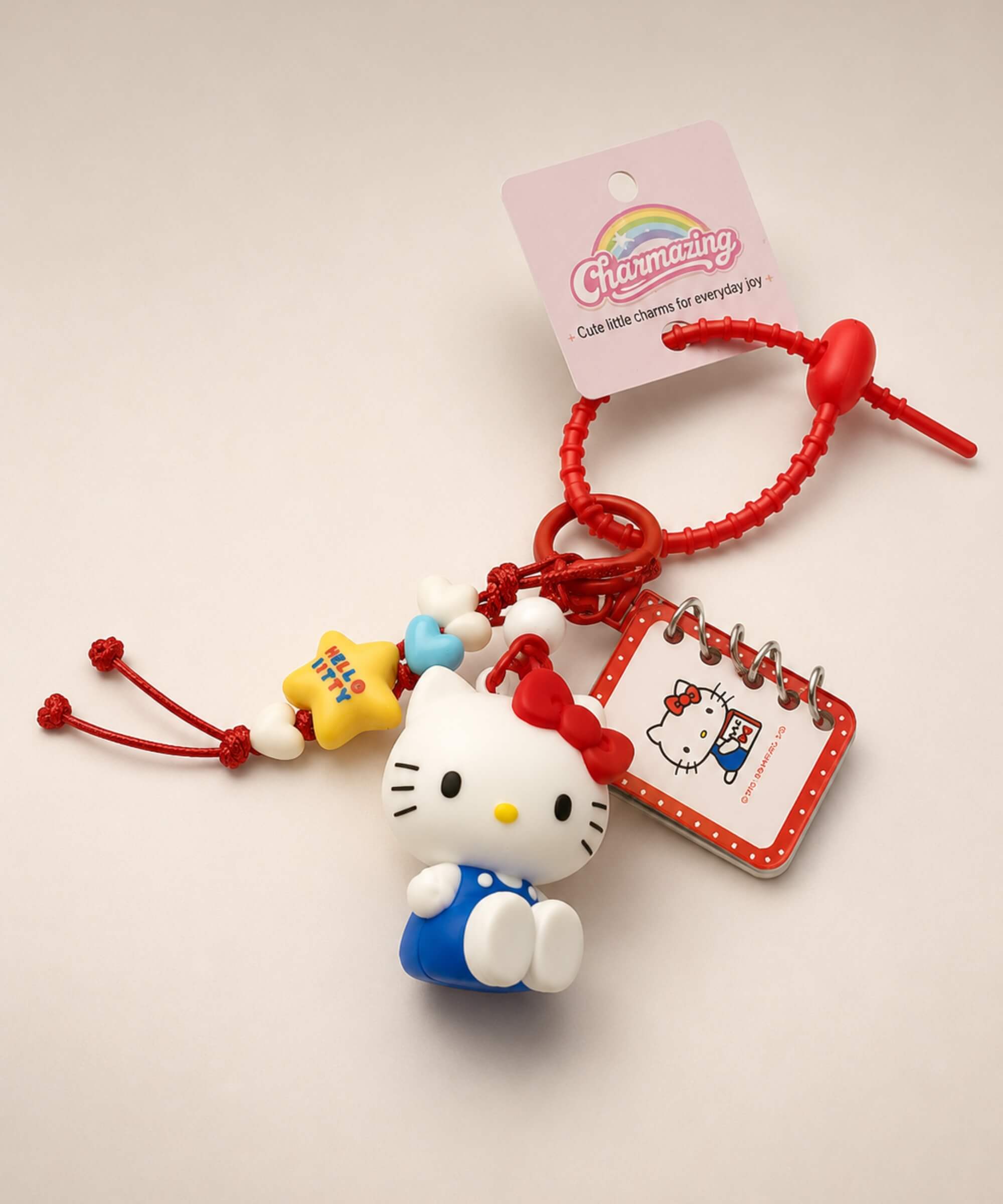 Hello Kitty book Sanrio keychain with red strap, mini notebook charm and character details